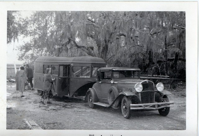 Hudson auto pulling trailer with wicker chairs.jpg